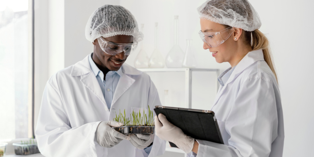 two lab workers analyzing sample and performing Laboratory Quality Control