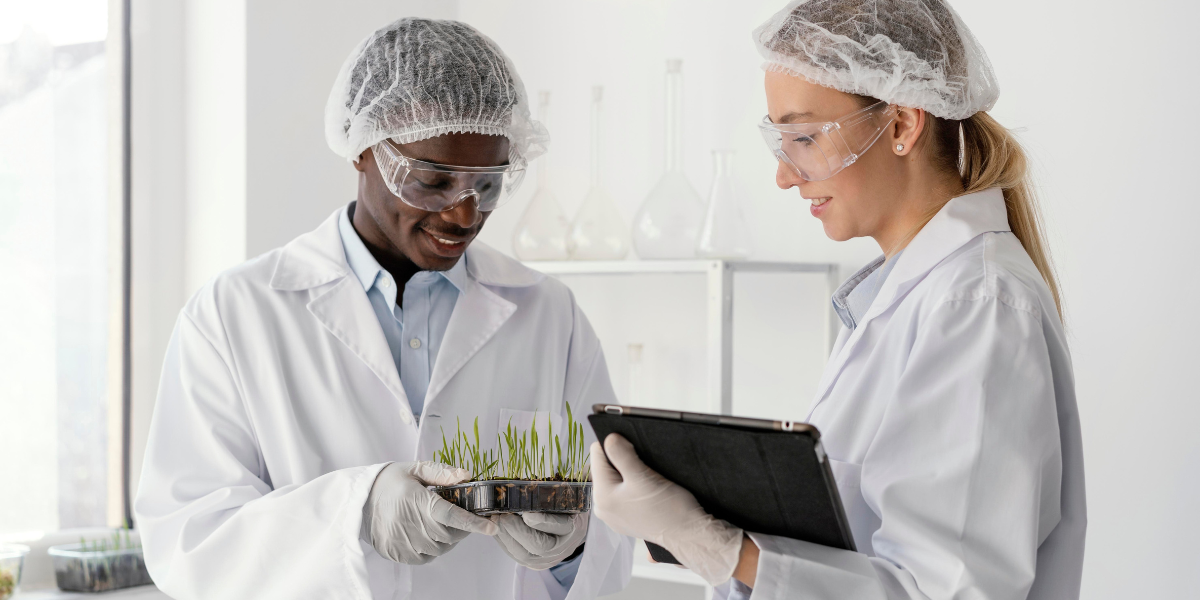 two lab workers analyzing sample