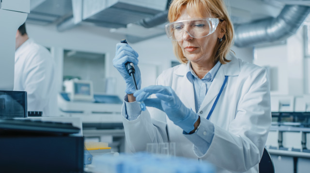 female scientist is public health lab