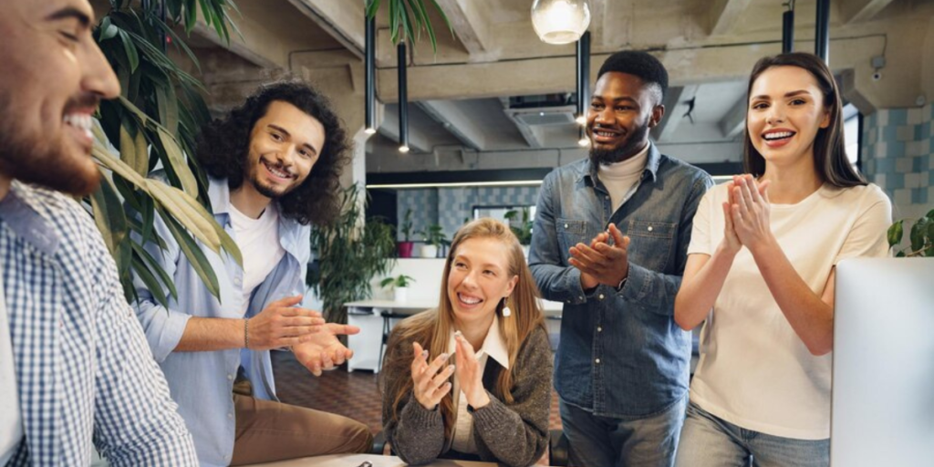 A group of happy employees in an office.