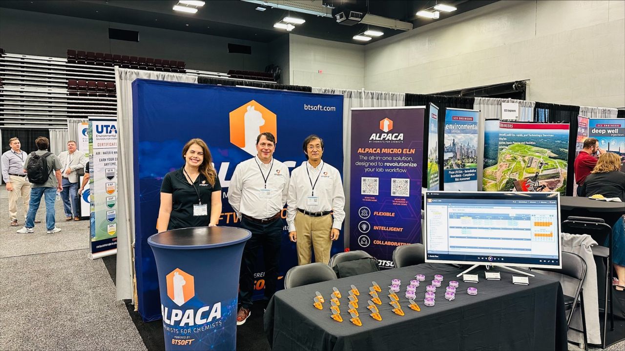 Victoria Littlepage, Chris Couch, and Bin Yu at a conference.