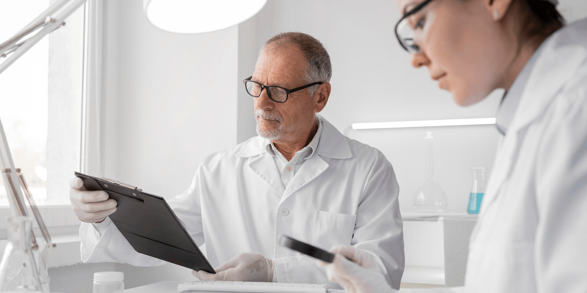 Two lab workers doing a laboratory audit