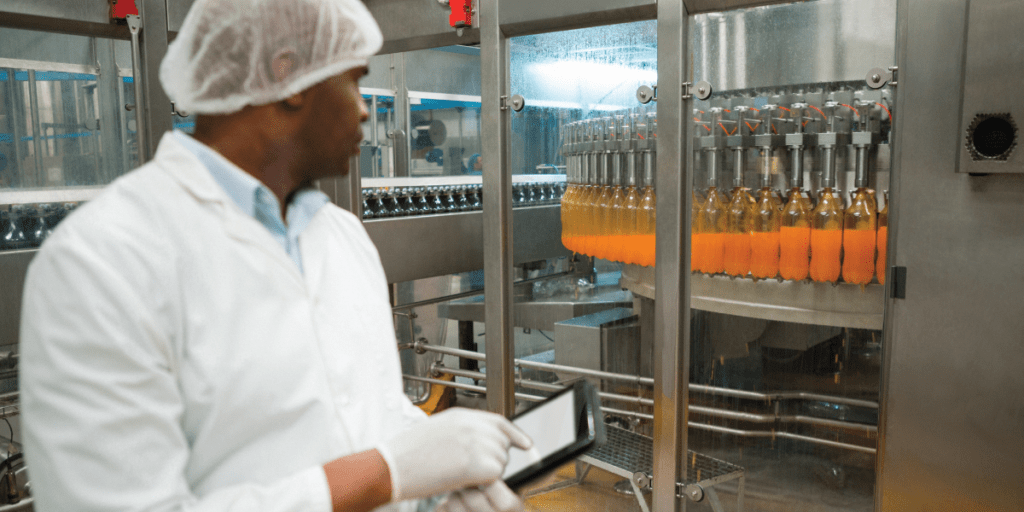 male scientist inspecting beverage bottling