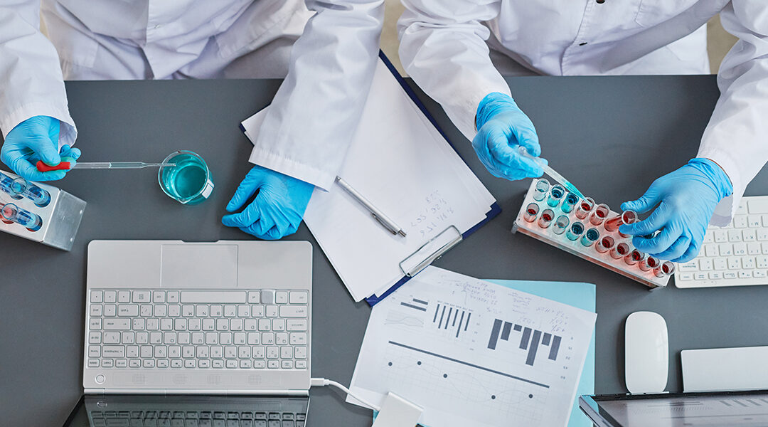 Scientists holding experiment with samples