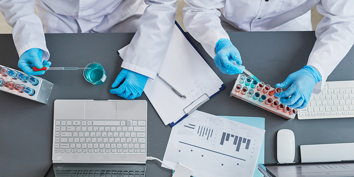 Scientists holding experiment with samples