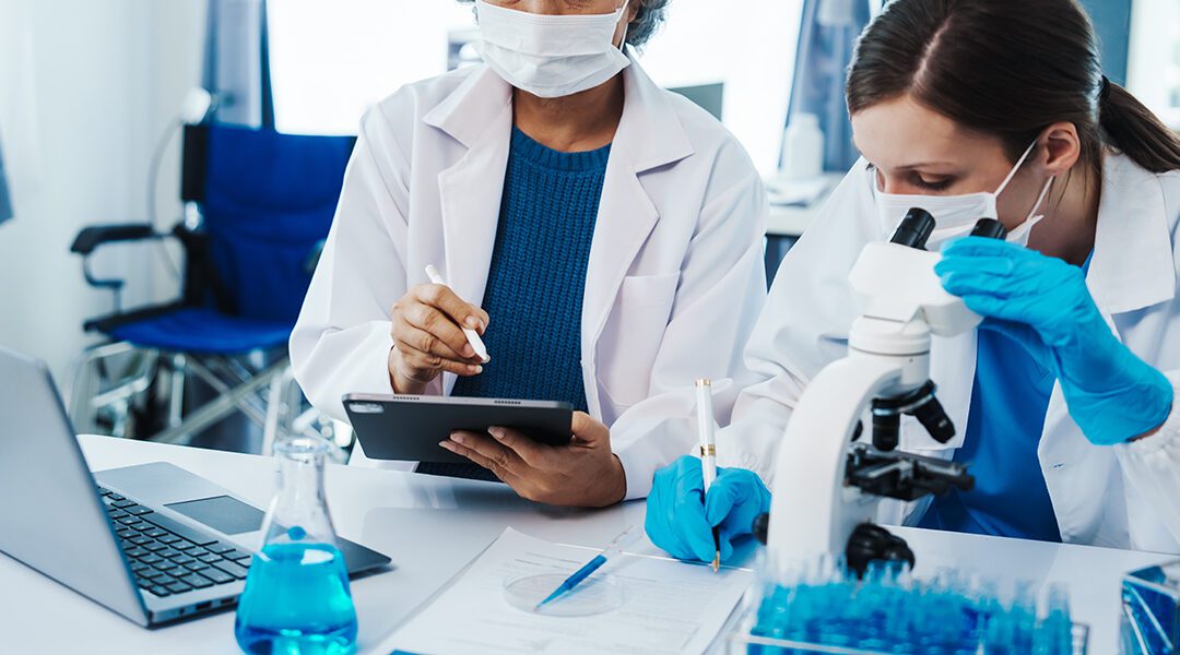 researchers working in life science laboratory