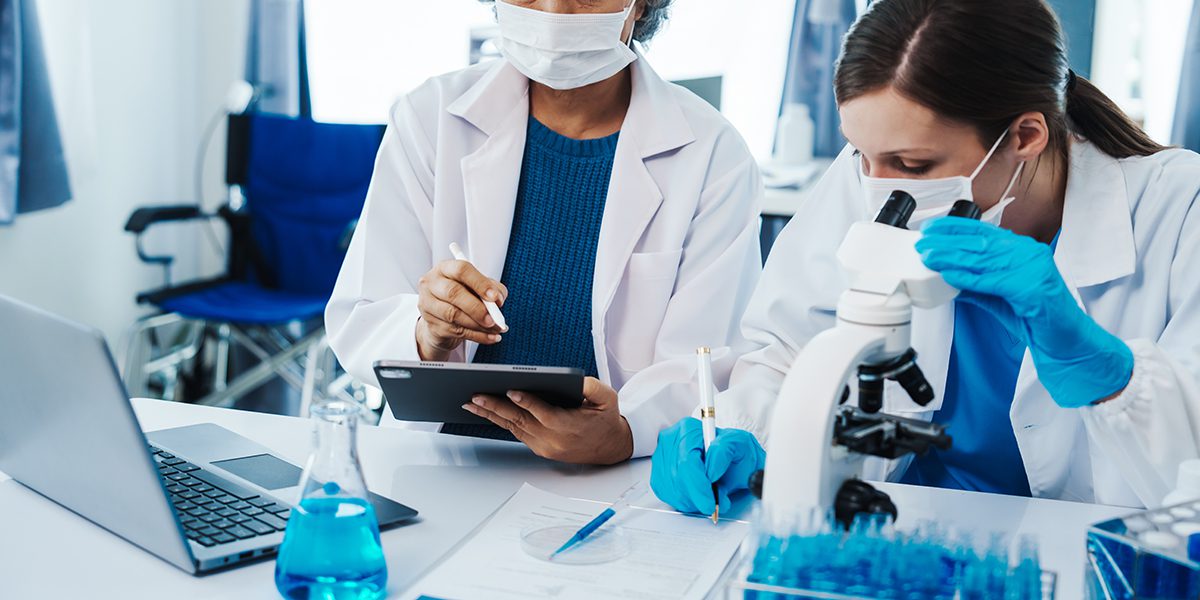 researchers working in life science laboratory